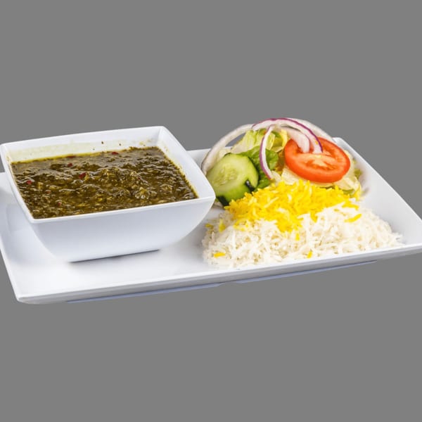 ZK Grill's Mediterranean dish with green stew, white rice, yellow rice, and a side salad.