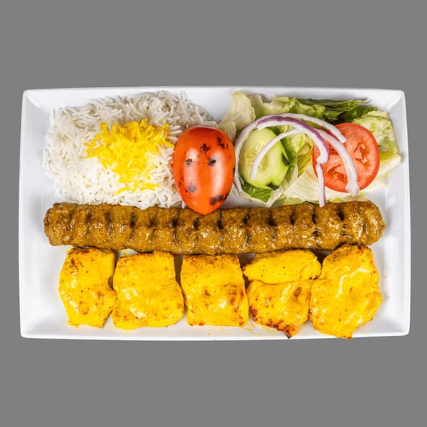 ZK Grill's Mediterranean platter with rice, grilled tomato, salad, beef koobideh, and chicken shish tawook.